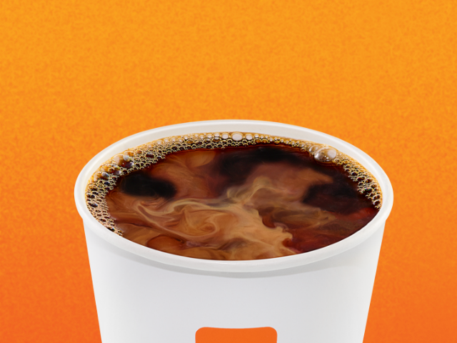 A cup of coffee with cream